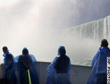 A group of tourists brave opening day on the bow of a Maid of the Mist ship