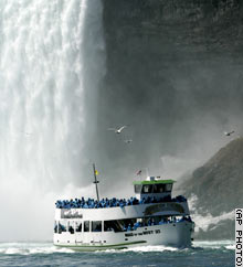 A Maid of the Mist ship exits the base of Horseshoe Falls