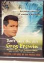 Greg Frewin poster in window